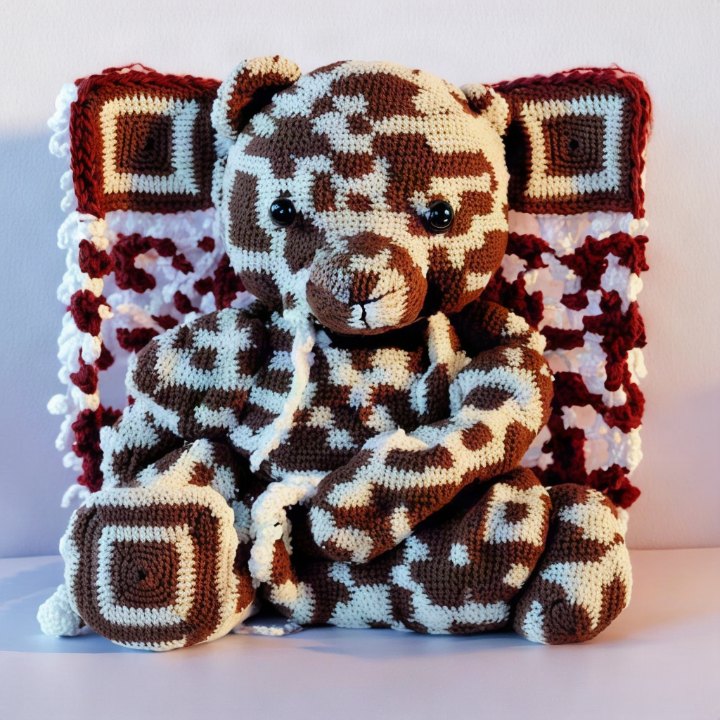 QR code crocheted into a teddy bear and blanket